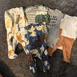 Lot of new born baby boy clothes. Lots of cute items